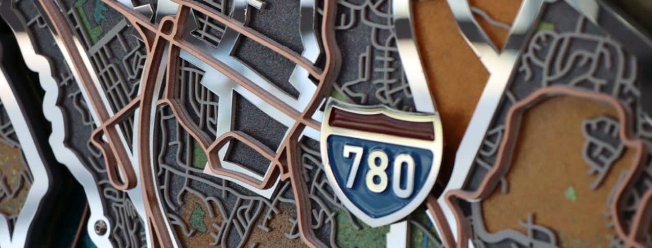 Mirrored steel highway lines around an Interstate 780 shield
